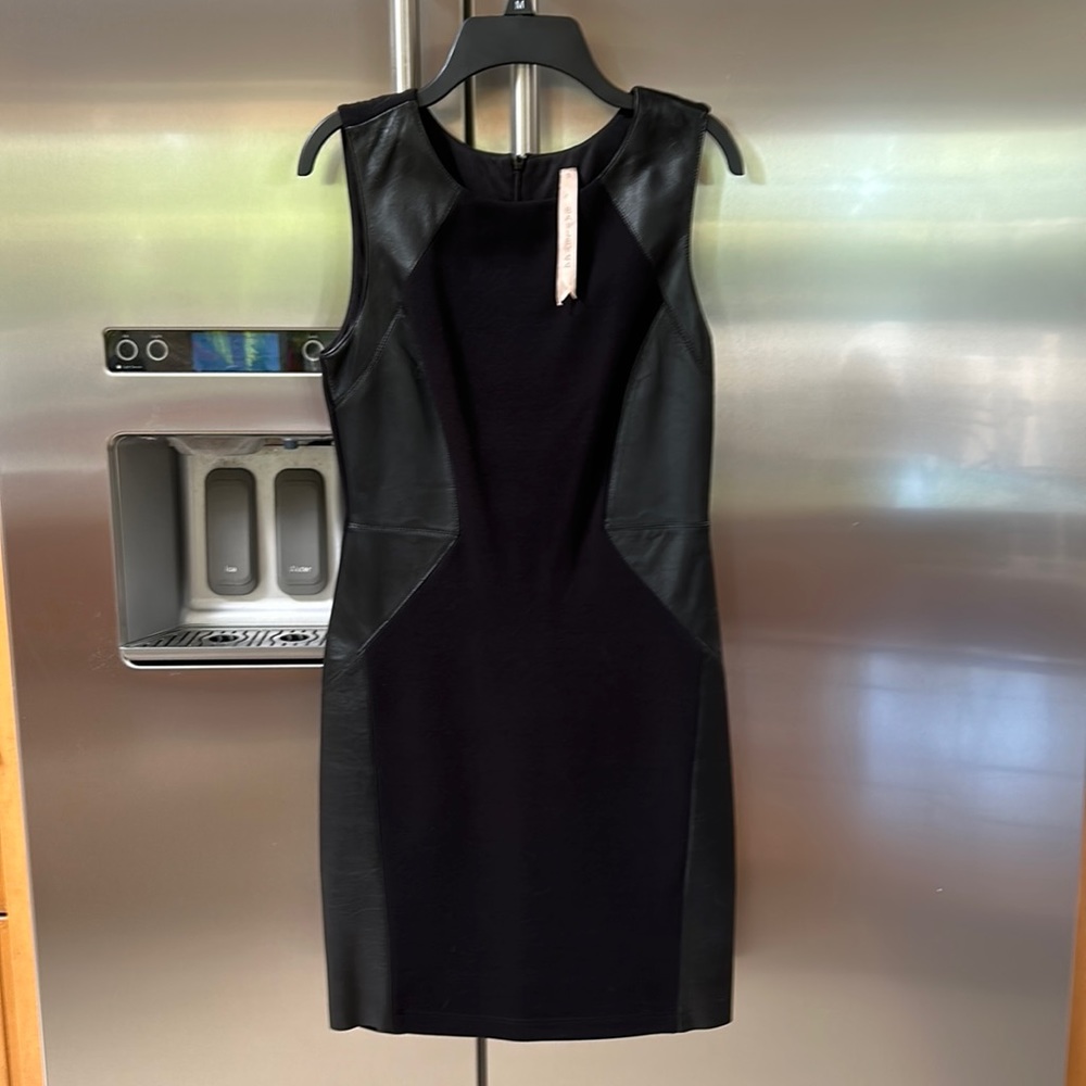 Bailley44 fitted above the knee dress with leather on the sides.